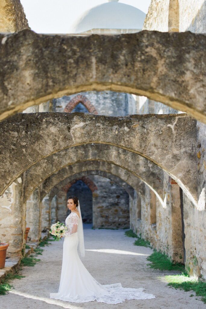 A stunning young woman taking her bridal portraits with the best wedding planner in Austin, TX Lila Lane Events