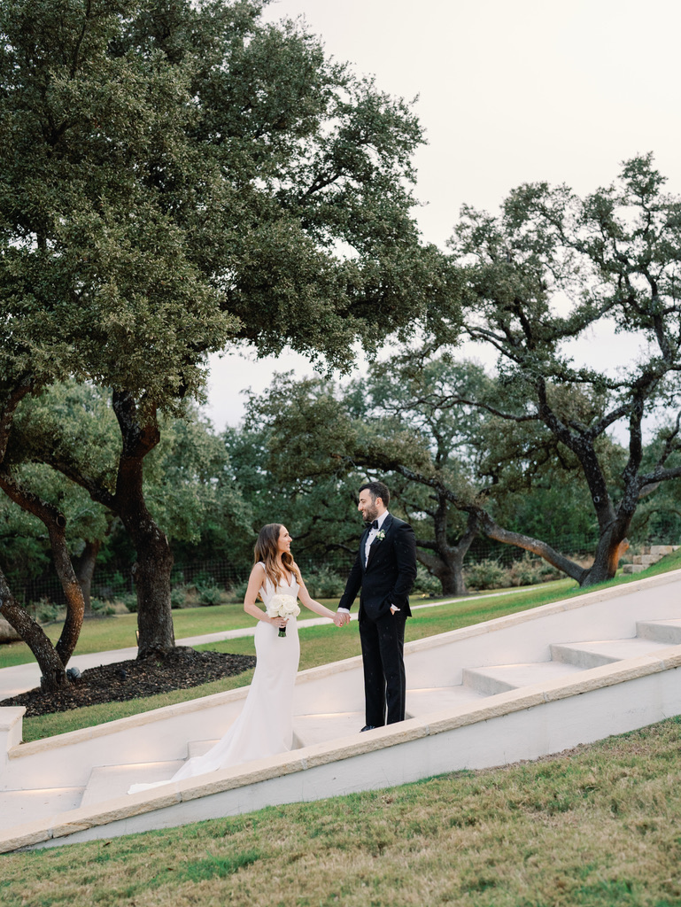 Bride and groom at outdoor ceremony steps at The Arlo, a modern Central Texas wedding venue.