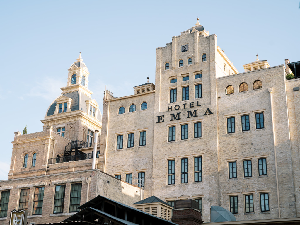 Hotel Emma exterior with historic architecture, one of the most iconic Central Texas wedding venues.