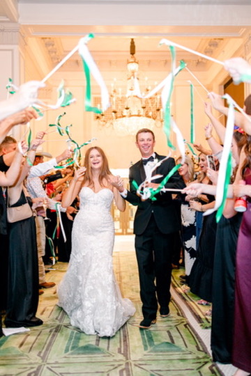 Wedding exit celebration with bride and groom at a Central Texas venue, coordinated by a local wedding planner.