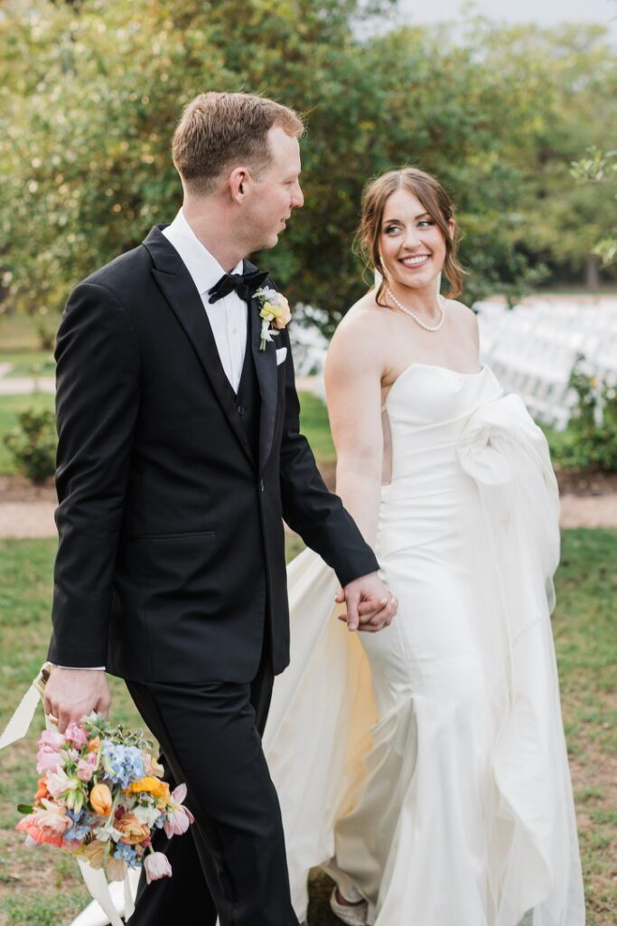 Bride and groom walking up the aisle after their outdoor ceremony at The Grand Lady, a Central Texas wedding venue.