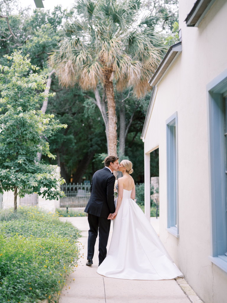 Palm trees and historic architecture at a Central Texas wedding venue, blending natural beauty with elegant design.