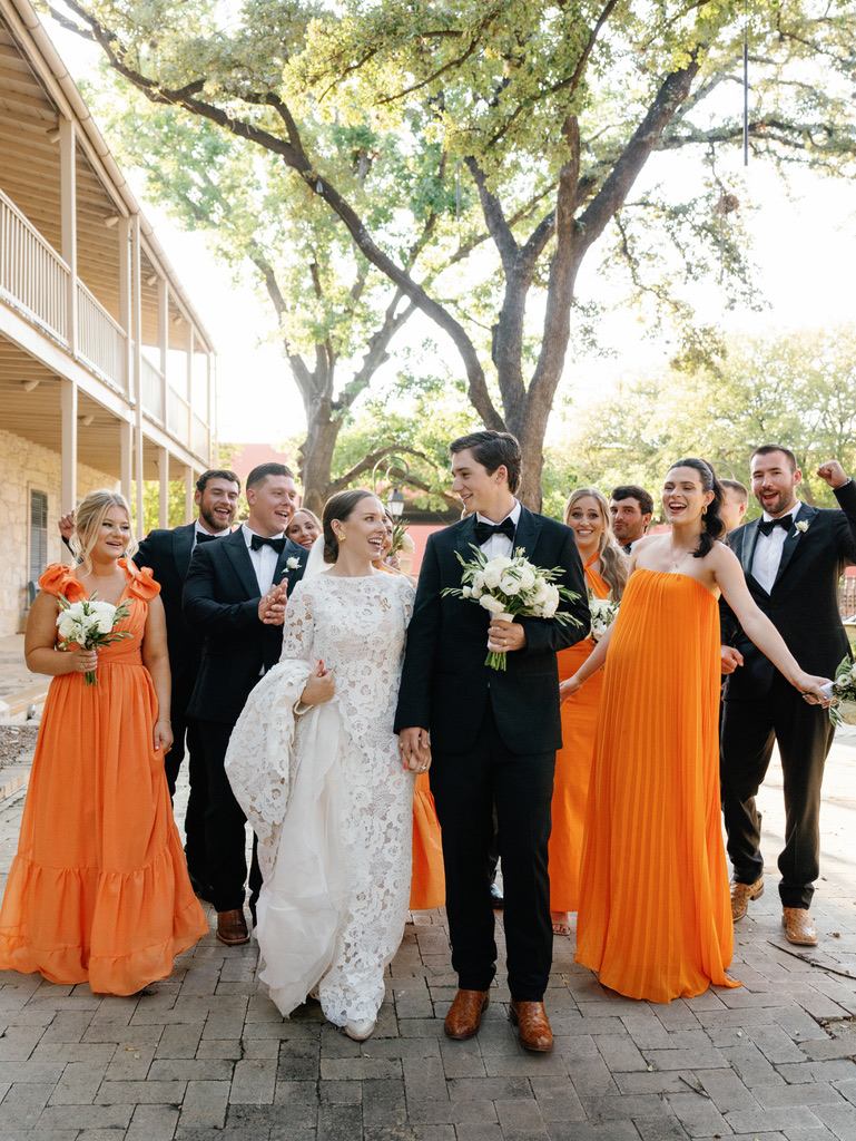 Bride and groom with wedding party at a Central Texas wedding venue, designed for a joyful celebration.