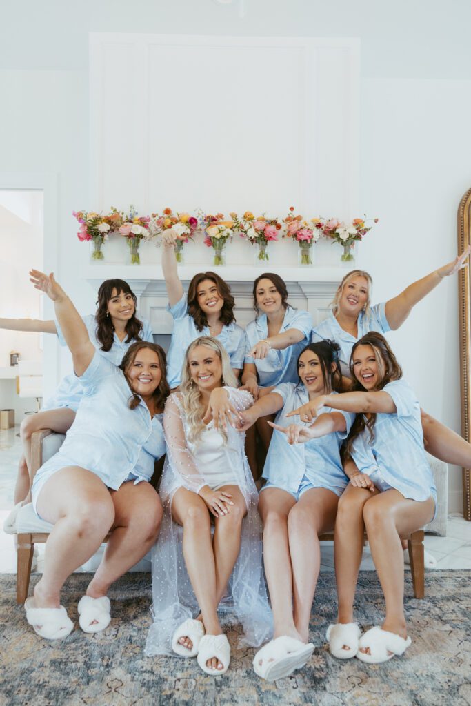 Bridal party celebrating in robes before the ceremony | Wedding day timeline guide in action by Austin wedding planner