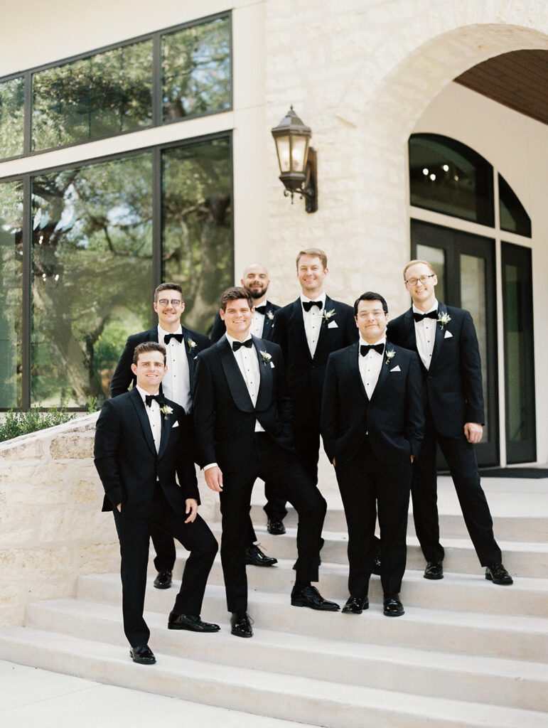 Groom and groomsmen heading to ceremony in classic black tuxes | San Antonio wedding timeline coordinated by Lila Lane Events