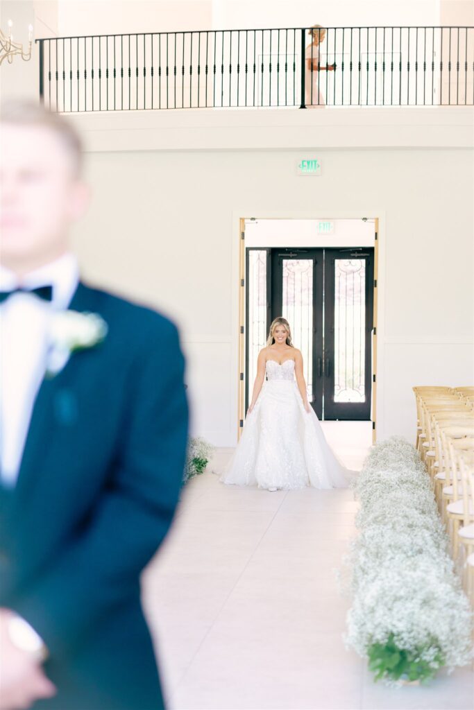 Bride walking down aisle for private first look 

