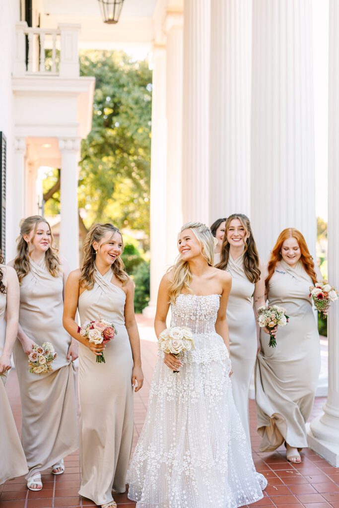 Bridal party on the steps of mansion