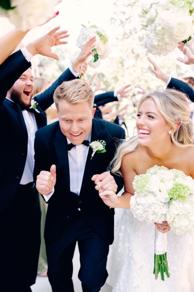 Bride and groom going through tunnel of love