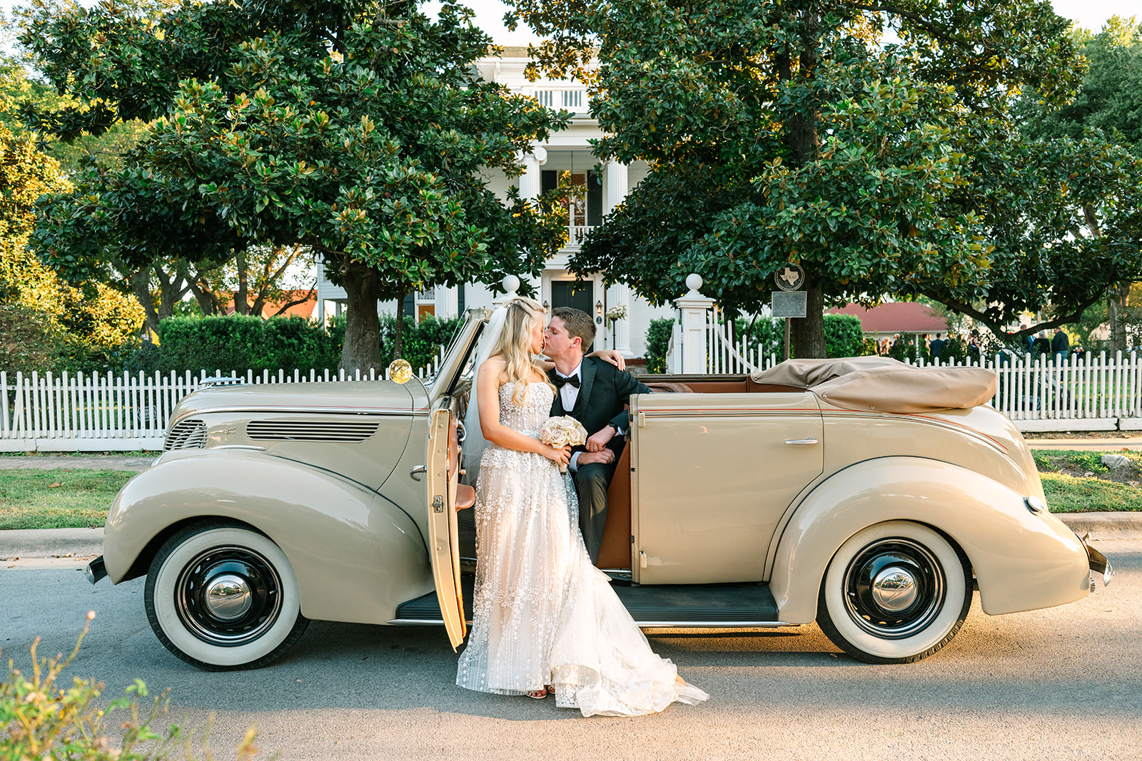 Beautiful couple in front of historic home with antique car on wedding day, so grateful for their wedding decisions they made.