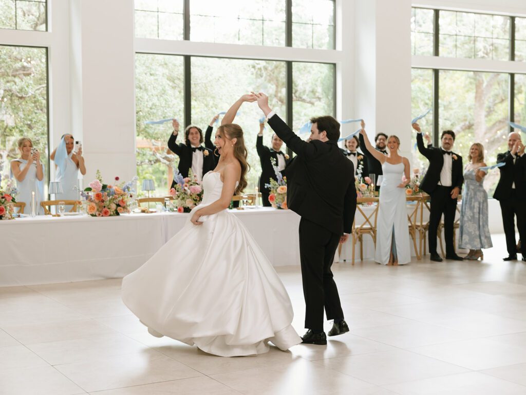 Newlyweds dancing at reception with the best wedding vendor list