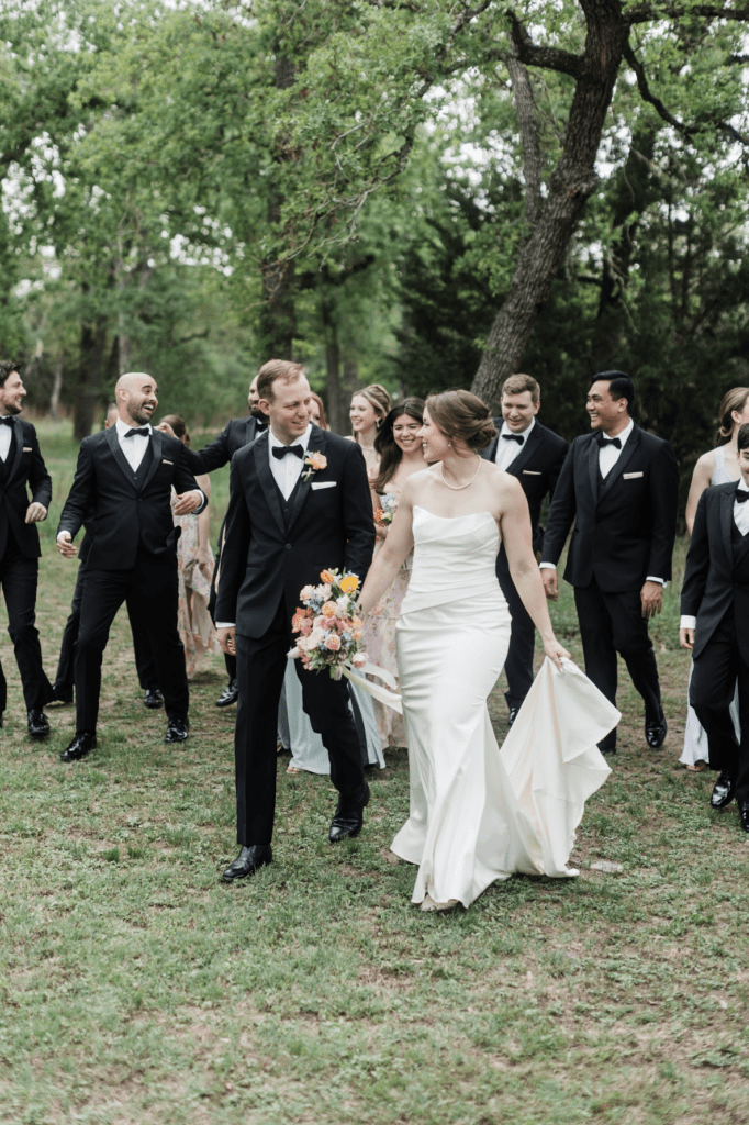 Bridal party walking through venue grounds