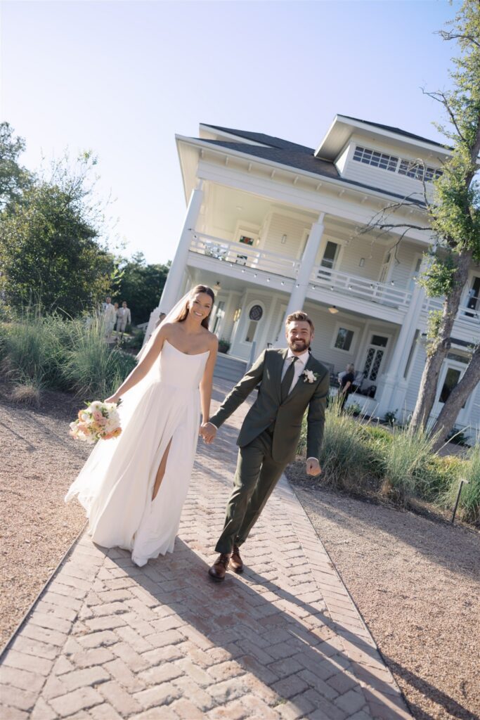 Newlyweds walking to cocktail hour