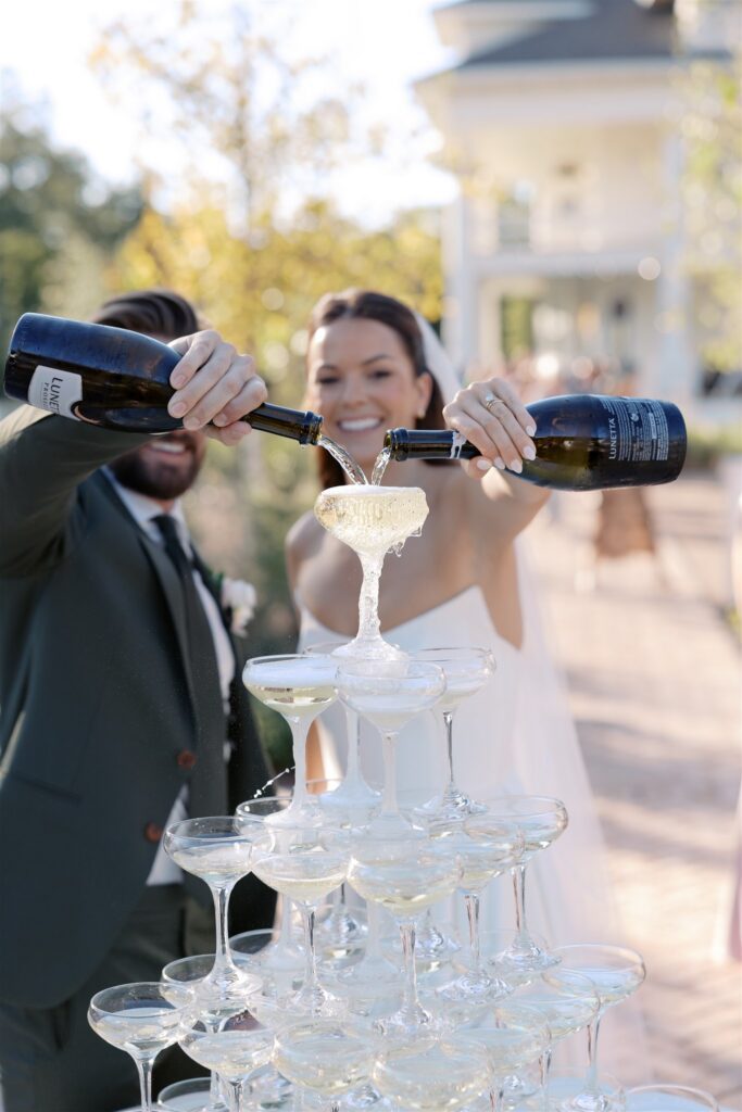 Bride and groom with champagne tower
