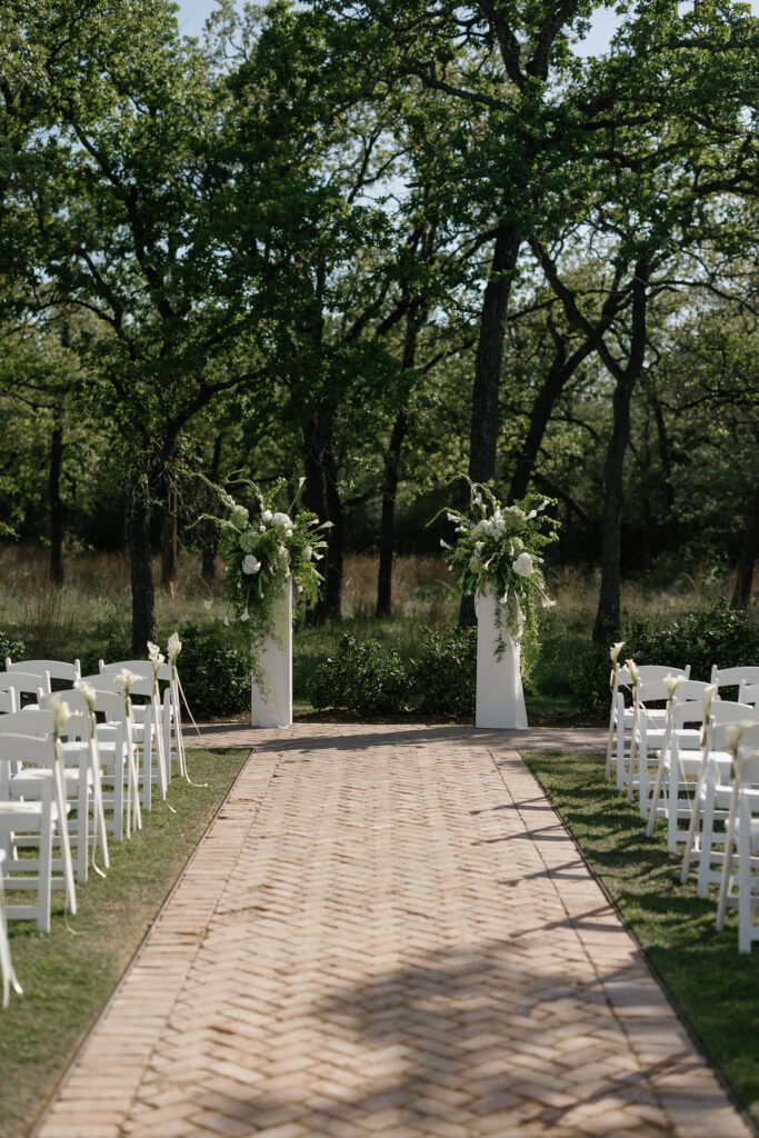 Outdoor ceremony floral pillars