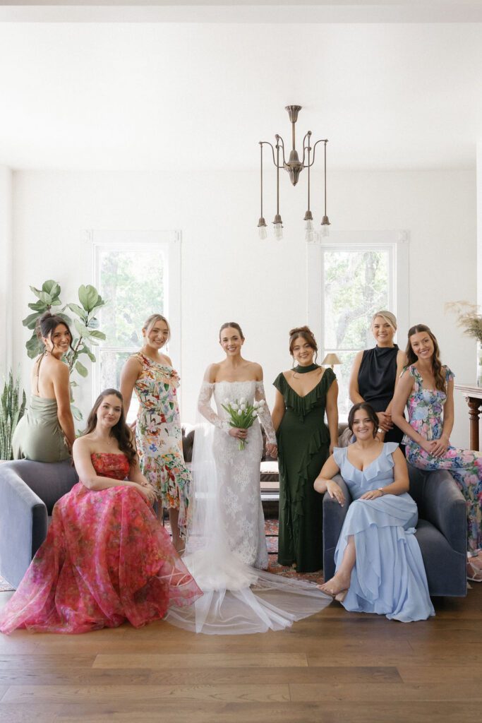 Bridal party posing inside historic home