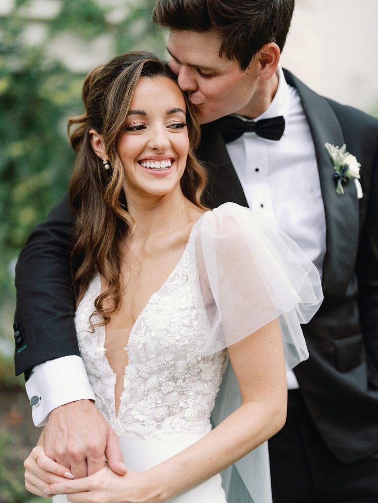 Newlyweds smiling on wedding day