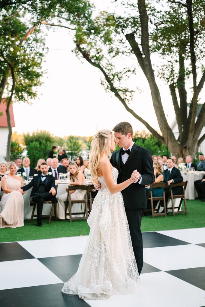 Sweet first dance on checkered dance floor