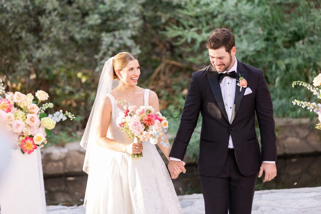 Happy newlyweds taking a walk