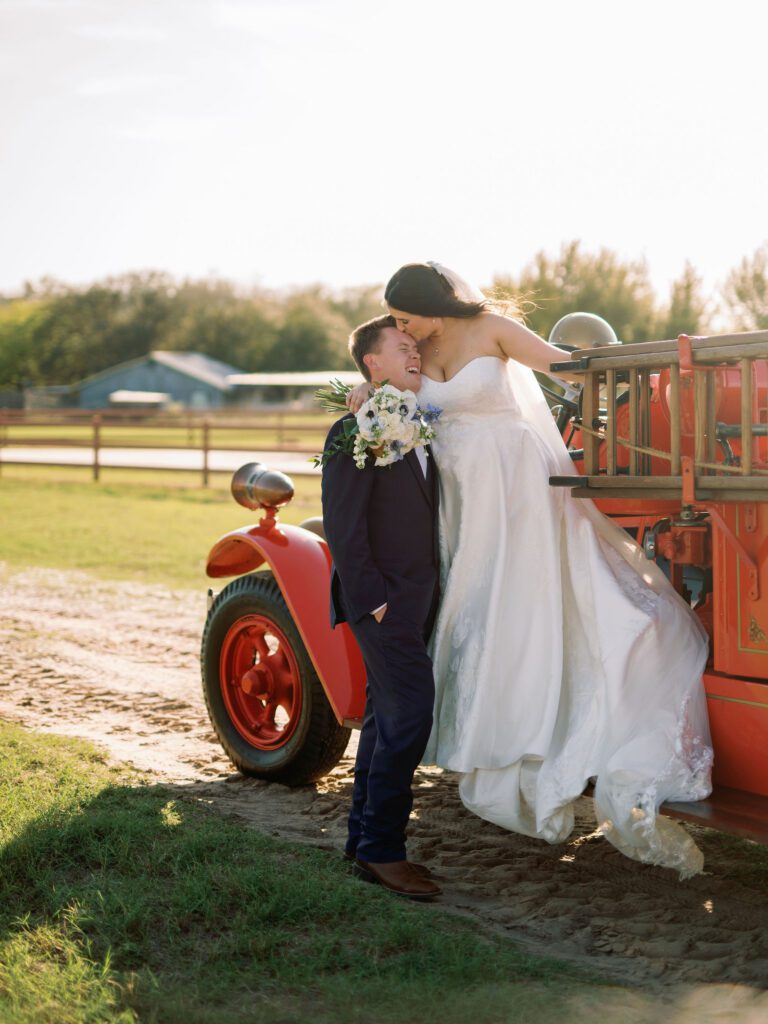 This personalized wedding idea involved an antique firetruck for this firefighter and his bride.