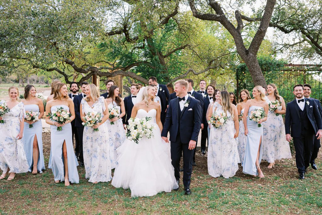 Sweet bridal party celebrating with their wedding planner in Central Texas